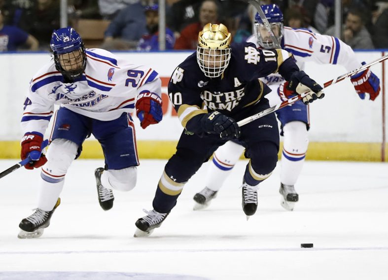 MANCHESTER, NH - MARCH 26: Notre Dame Fighting Irish right wing Anders Bjork (10) breaks away from UMass Lowell River Hawks right wing John Edwardh (29) during the NCAA Northeast Regional final between the UMass Lowell River Hawks and the Notre Dame Fighting Irish on March 26, 2017, at SNHU Arena in Manchester, New Hampshire. The Fighting Irish defeated the River Hawks 3-2 (OT). (Photo by Fred Kfoury III/Icon Sportswire)