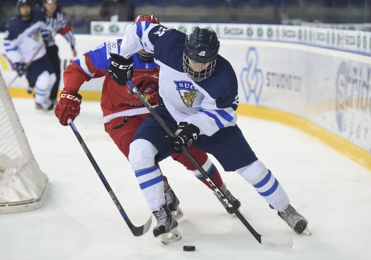 POPRAD, SLOVAKIA - APRIL 22: Finland's Santeri Virtanen #22 carries the puck during semifinal round action at the 2017 IIHF Ice Hockey U18 World Championship. (Photo by Andrea Cardin/HHOF-IIHF Images)