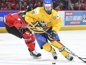 MONTREAL, CANADA - JANUARY 4: Canada's Thomas Chabot #5 stick checks Sweden's Rasmus Dahlin #8 during semifinal round action at the 2017 IIHF World Junior Championship. (Photo by Matt Zambonin/HHOF-IIHF Images)