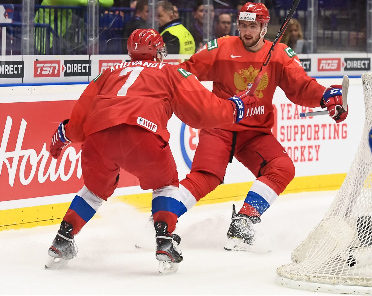 OSTRAVA, CZECH REPUBLIC - JANUARY 4: Russia's Yegor Sokolov #13 celebrates his first period goal against Sweden's with Alexander Khovanov #7 during semifinal round action at the 2020 IIHF World Junior Championship at Ostravar Arena on January 4, 2020 in Ostrava, Czech Republic. (Photo by Matt Zambonin/HHOF-IIHF Images)